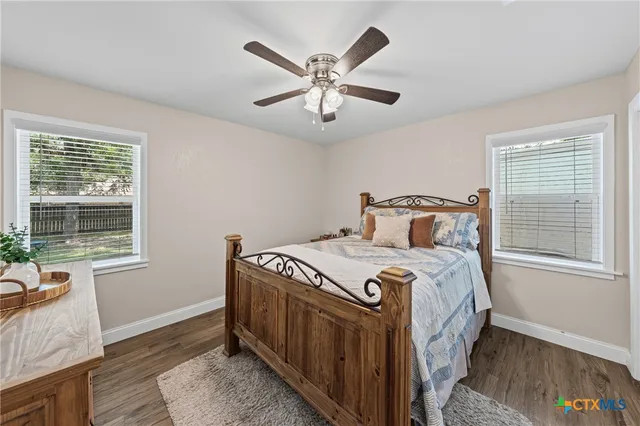 a bedroom with a bed and window