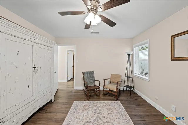a living room with furniture and a rug