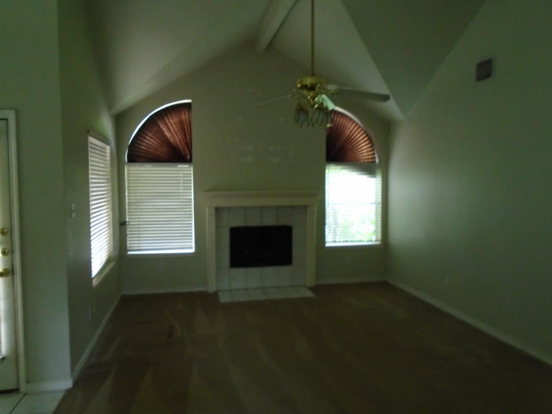 7817 Duchess Street Corpus Christi, TX 78413 - Photo 3 of 11 a living room with a fireplace