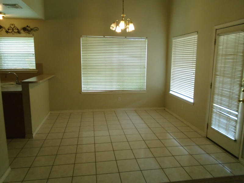 7817 Duchess Street Corpus Christi, TX 78413 - Photo 7 of 11 a view of an empty room with a window