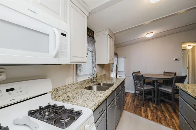 a kitchen with a table and chairs in it