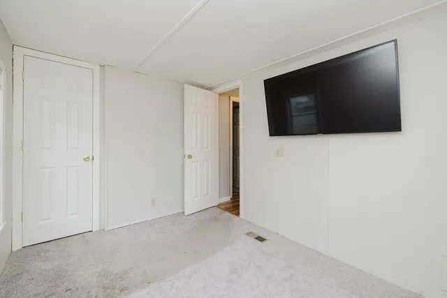 a view of a livingroom with a flat screen tv