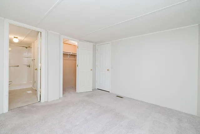 an empty room with closet area