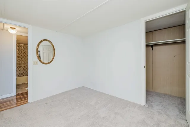 a view of room with window and a ceiling fan