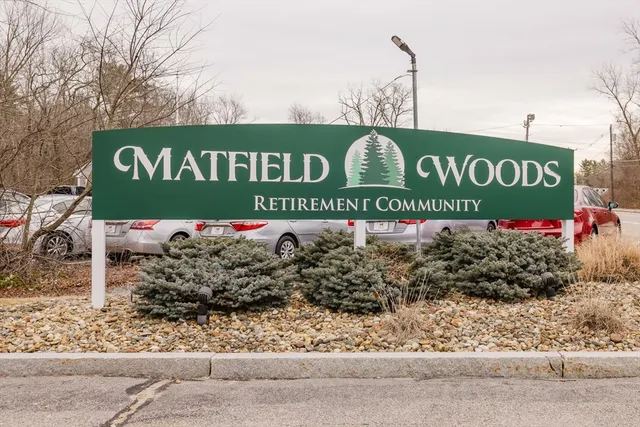 a sign broad in front of a building
