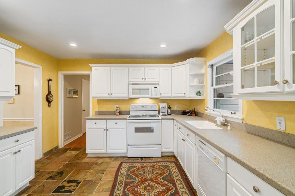 2368 Peeler Road Dunwoody, GA 30338 - Photo 14 of 47 a kitchen with a sink stove and refrigerator