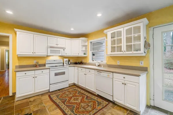 a kitchen with a sink and cabinets