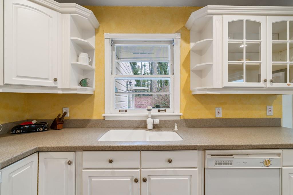 2368 Peeler Road Dunwoody, GA 30338 - Photo 16 of 47 a kitchen with a sink and cabinets