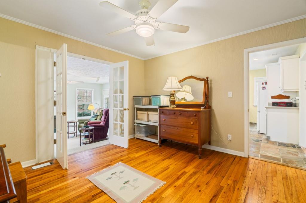 2368 Peeler Road Dunwoody, GA 30338 - Photo 18 of 47 a bed room with a bed and dresser