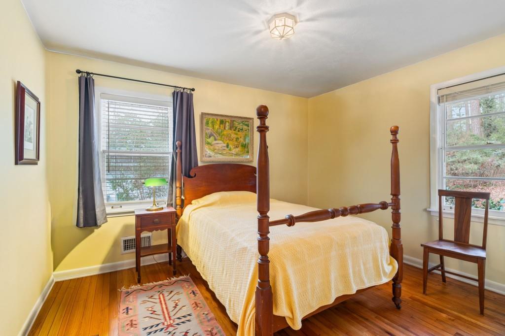 2368 Peeler Road Dunwoody, GA 30338 - Photo 25 of 47 a bed sitting in a bedroom next to a window