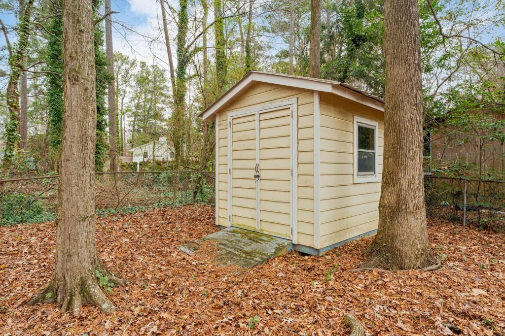 2368 Peeler Road Dunwoody, GA 30338 - Photo 31 of 47 a view of a house with a yard