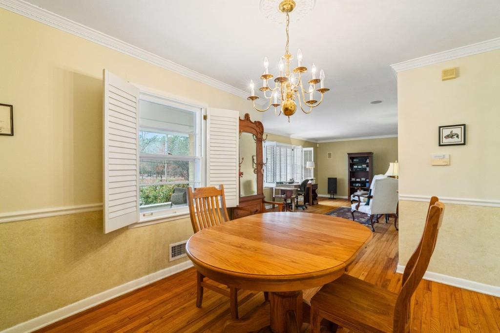 2368 Peeler Road Dunwoody, GA 30338 - Photo 10 of 47 a view of a dining room with furniture window and outside view