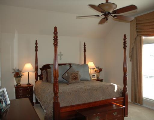 5102 Spring Brook Drive Corpus Christi, TX 78413 - Photo 4 of 8 a bedroom with a bed and a lamp