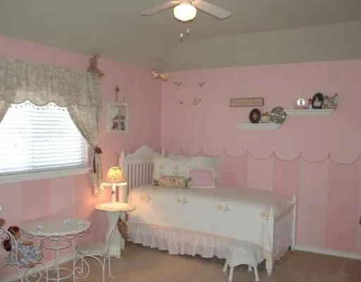 a bedroom with a bed dresser and a window