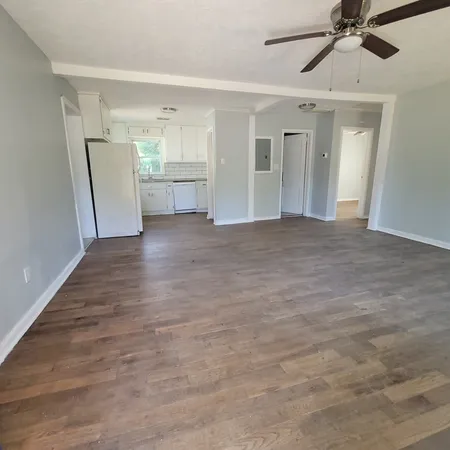 a view of an empty room and a window