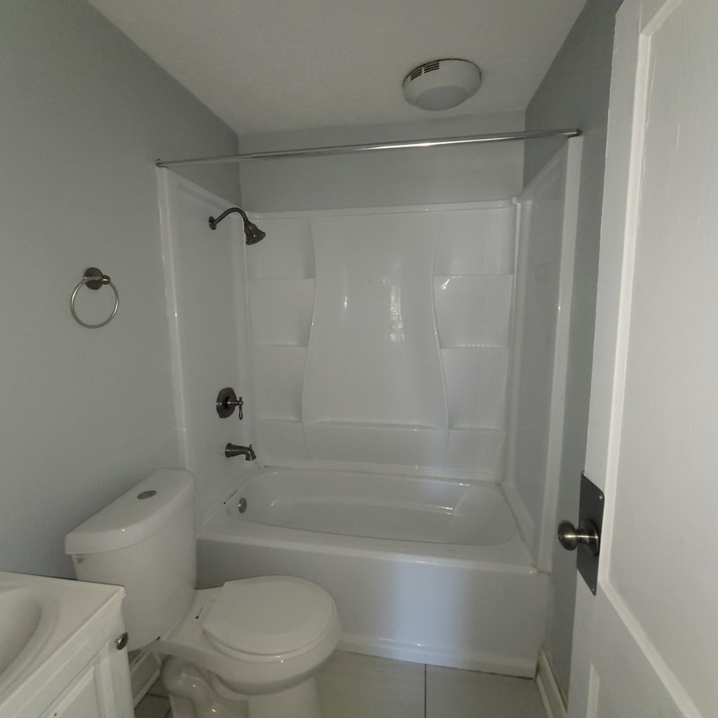 2719 Lee Street Columbus, GA 31903 - Photo 8 of 8 a bathroom with a bathtub toilet and vanity