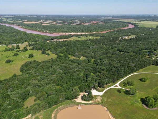 a view of a lake with a big yard