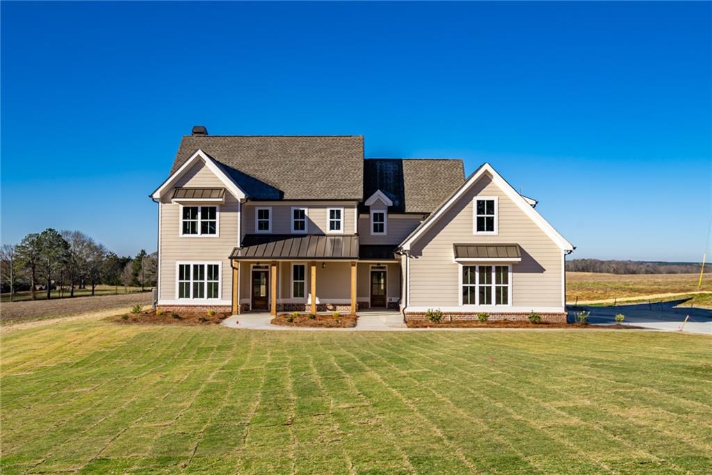 2180 Lower Apalachee Road Madison, GA 30650 - Photo 1 of 1 a view of a house with a swimming pool