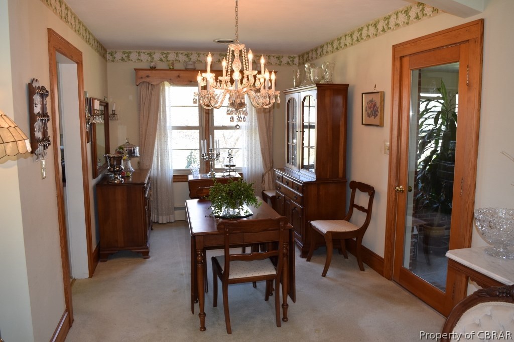 4288 Cedar Bush Road Hayes, VA 23072 - Photo 7 of 48 Formal Dining Room. Glass patio door leads to sunroom.