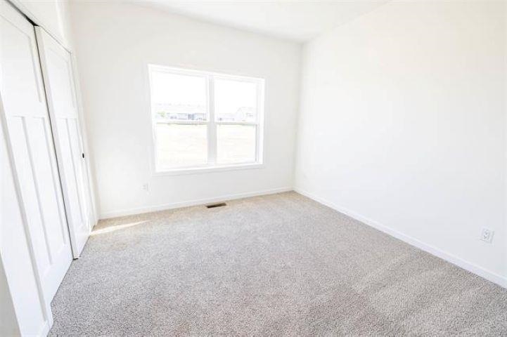 14200 Prairie Commons Lane South Beloit, IL 61080 - Photo 11 of 13 an empty room with a window
