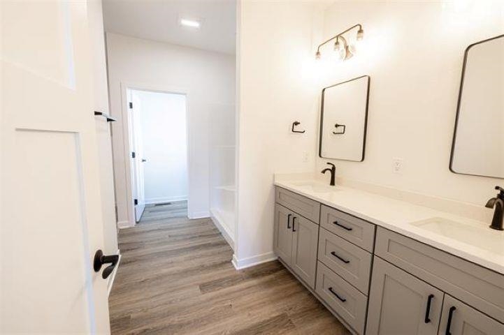 14200 Prairie Commons Lane South Beloit, IL 61080 - Photo 8 of 13 a spacious bathroom with a double vanity sink and a mirror