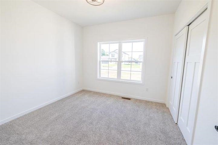 14200 Prairie Commons Lane South Beloit, IL 61080 - Photo 9 of 13 an empty room with windows