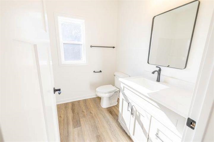 14200 Prairie Commons Lane South Beloit, IL 61080 - Photo 10 of 13 a bathroom with a sink a toilet and a mirror