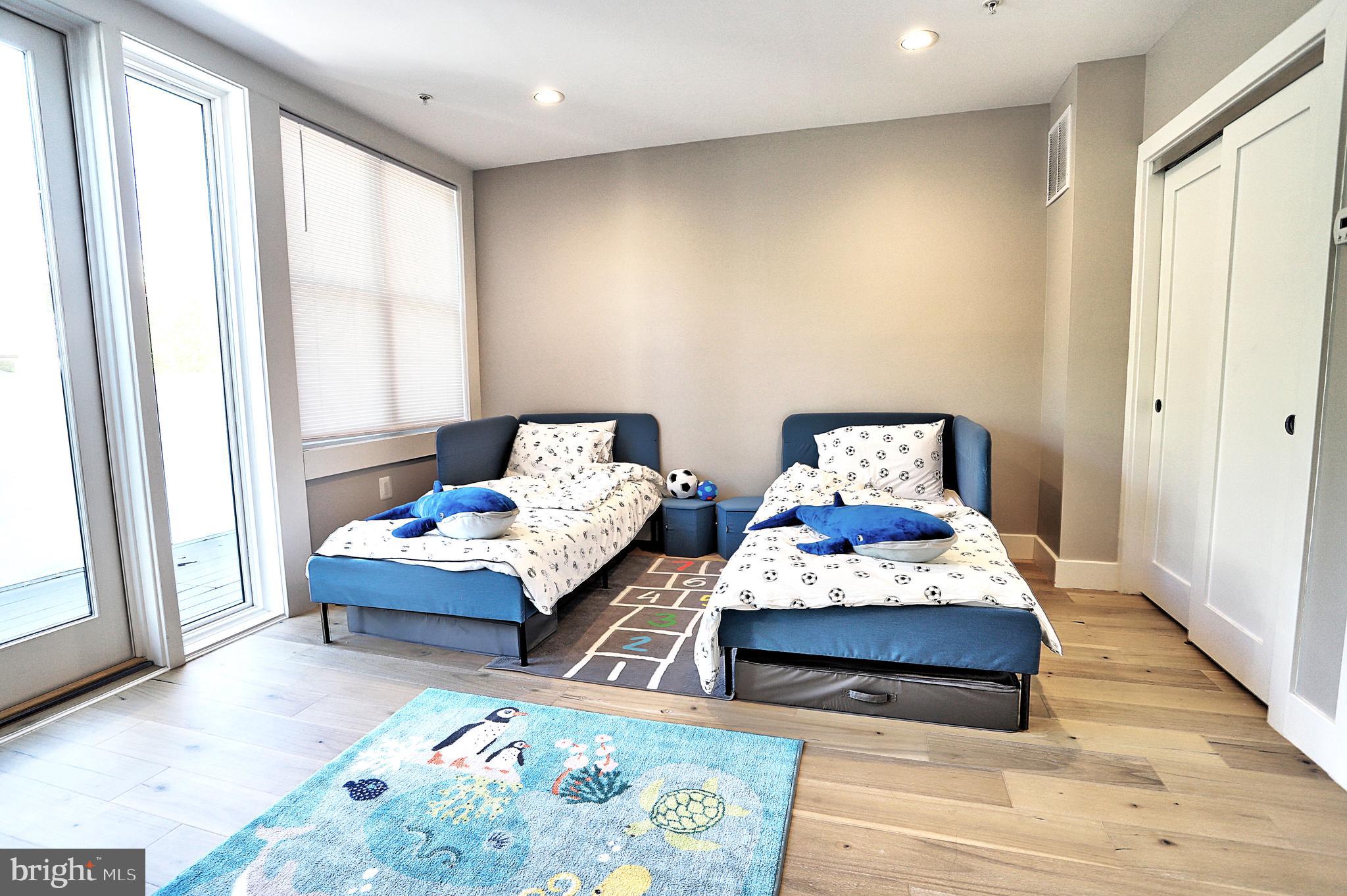 1723 Wisconsin Avenue Northwest, Unit C Washington, DC 20007 - Photo 16 of 18 a bedroom with two beds and a window