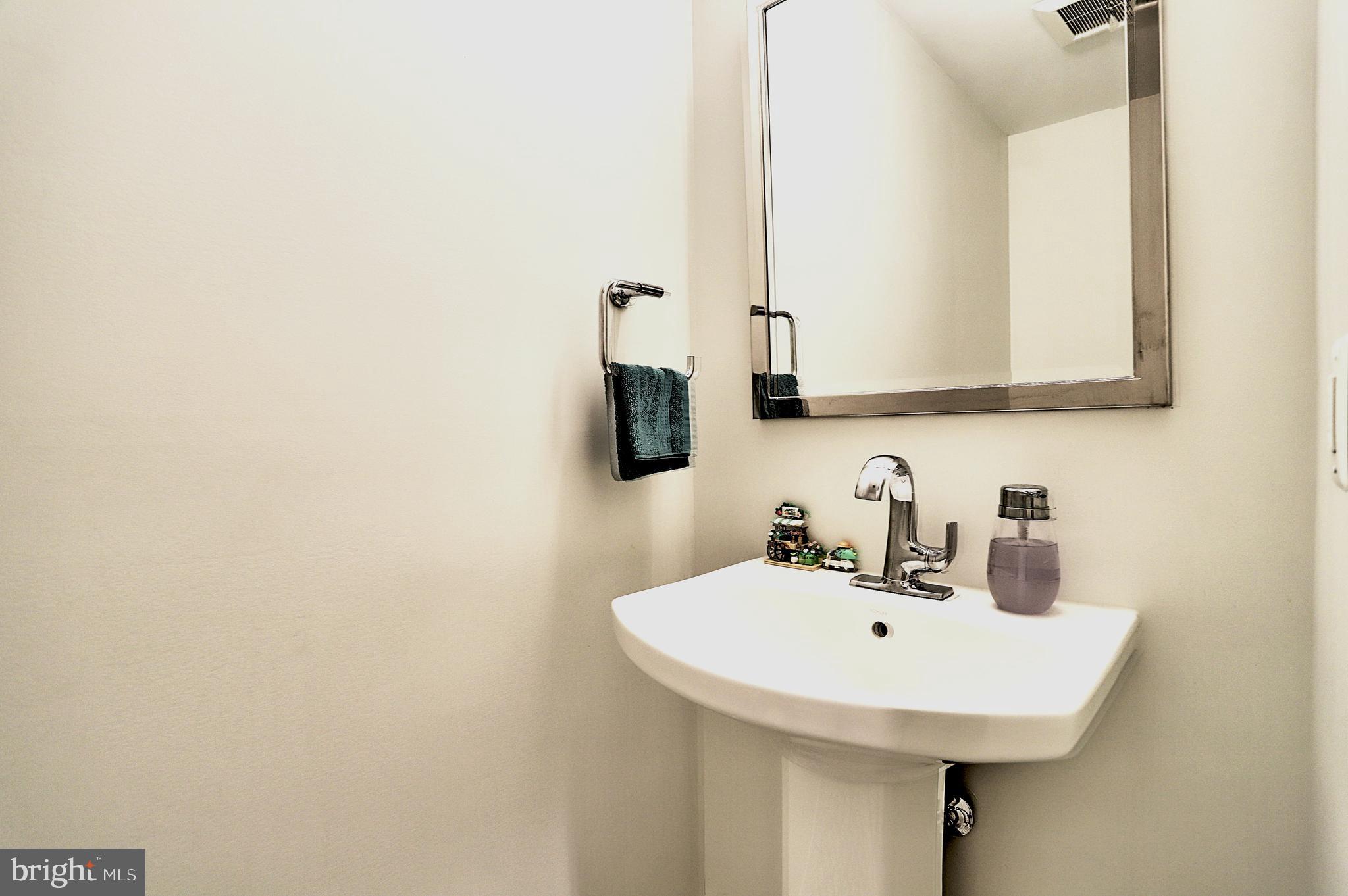 1723 Wisconsin Avenue Northwest, Unit C Washington, DC 20007 - Photo 10 of 18 a bathroom with a sink and a mirror