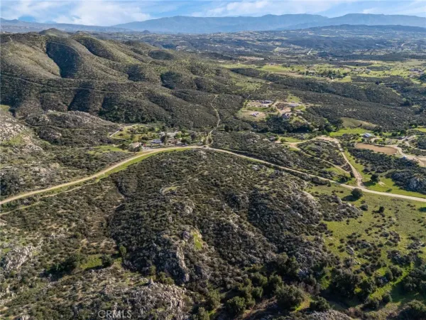 an aerial view of residential house and green space