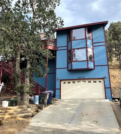 a view of a house with large windows