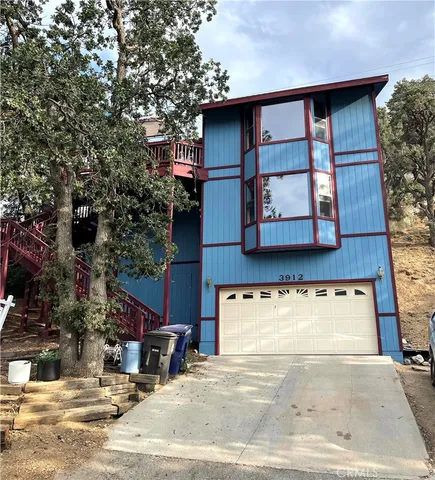 a view of a house with large windows