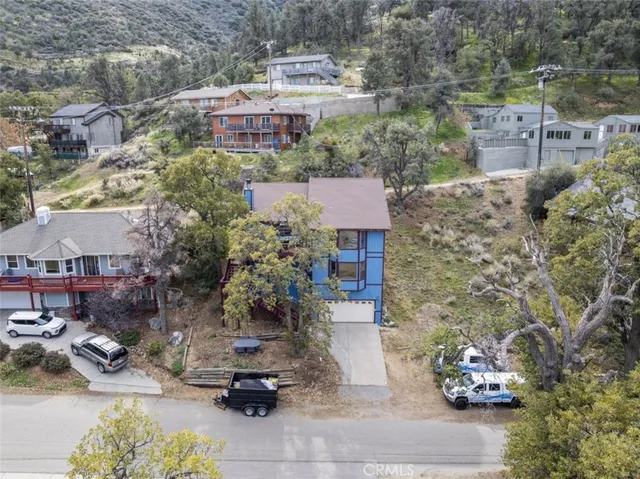 a picture of table and chairs with potted plants