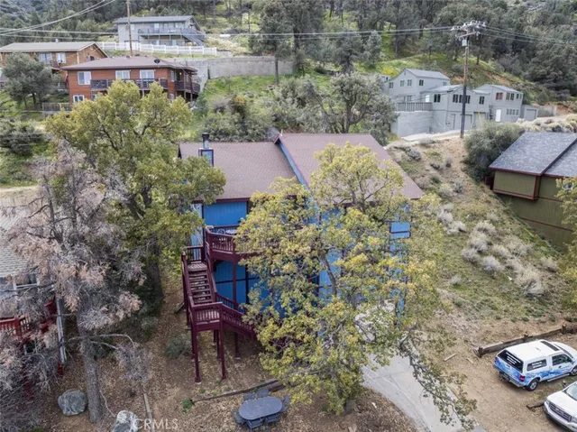 a aerial view of a house with a yard