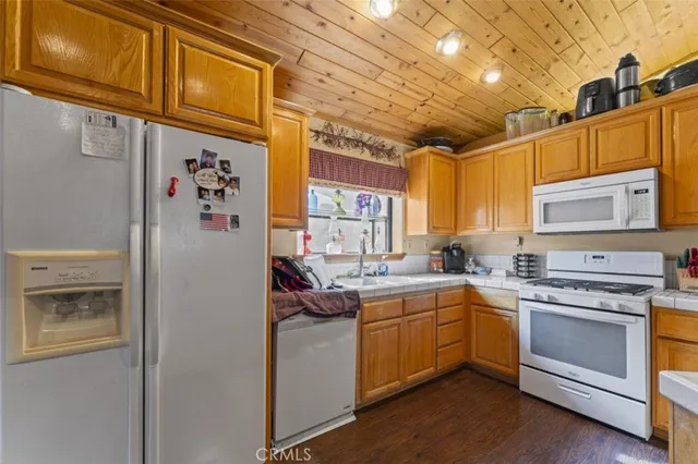 a kitchen with cabinets and window