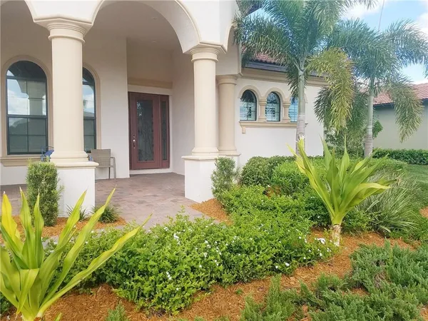 front view of a house with a garden