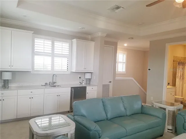 a living room with a couch and a window