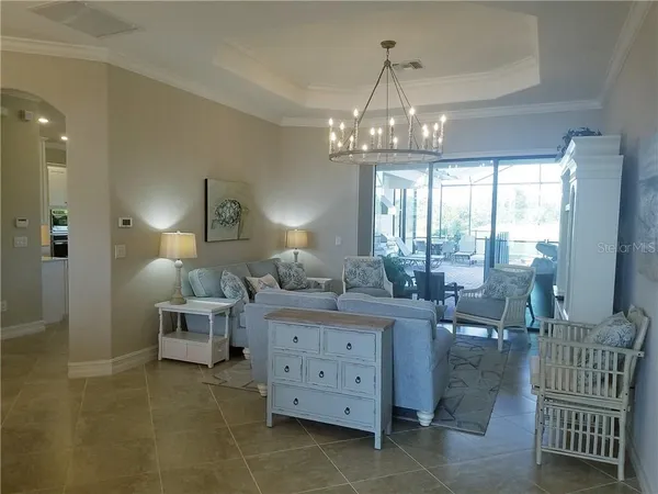 a view of a livingroom with furniture and chandelier