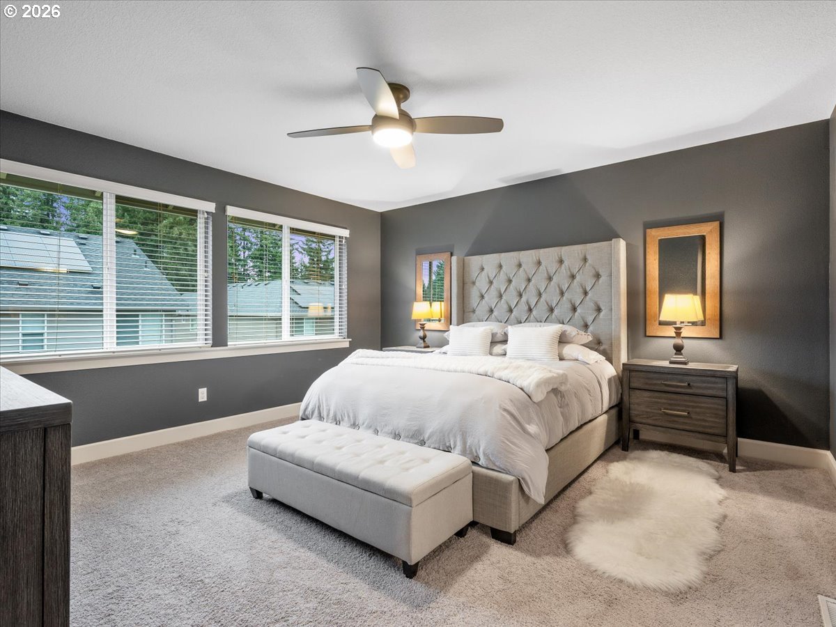602 Northeast 149th Way Vancouver, WA 98685 - Photo 23 of 48 a bedroom with a large bed and a large window