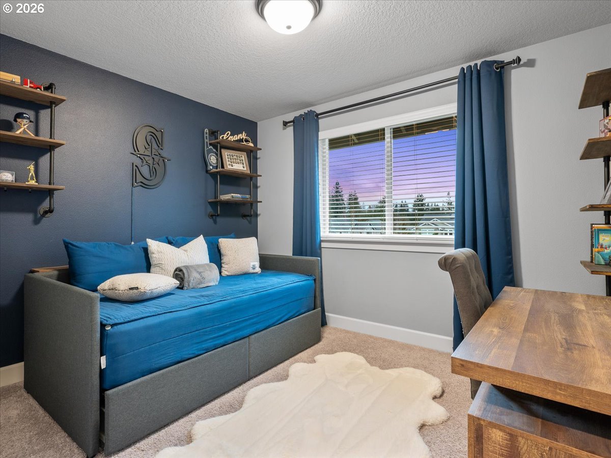 602 Northeast 149th Way Vancouver, WA 98685 - Photo 32 of 48 a bedroom with furniture and a window