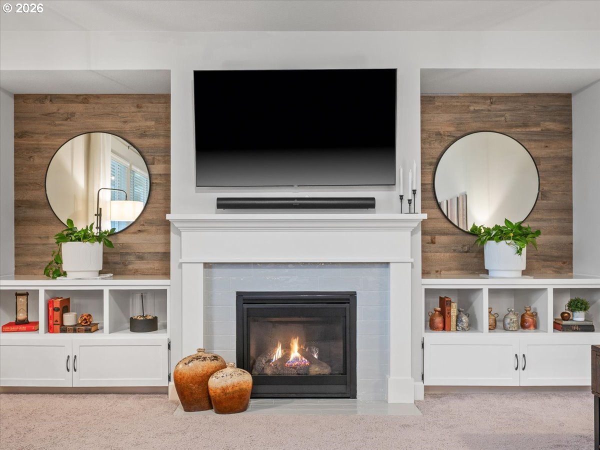 602 Northeast 149th Way Vancouver, WA 98685 - Photo 7 of 48 a living room with a fireplace and a flat screen tv