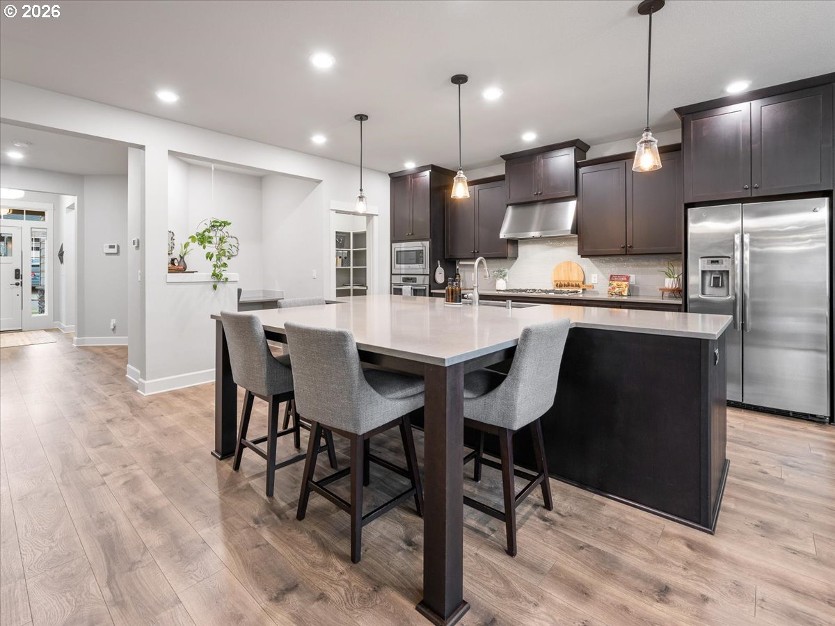 602 Northeast 149th Way Vancouver, WA 98685 - Photo 9 of 48 a kitchen with refrigerator and chairs