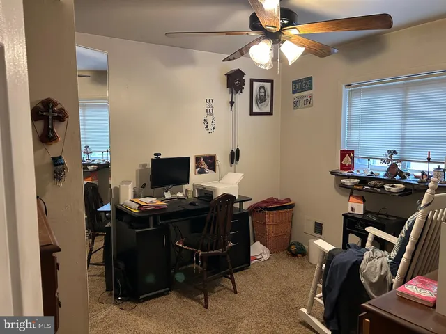 a bedroom with bed and a fireplace