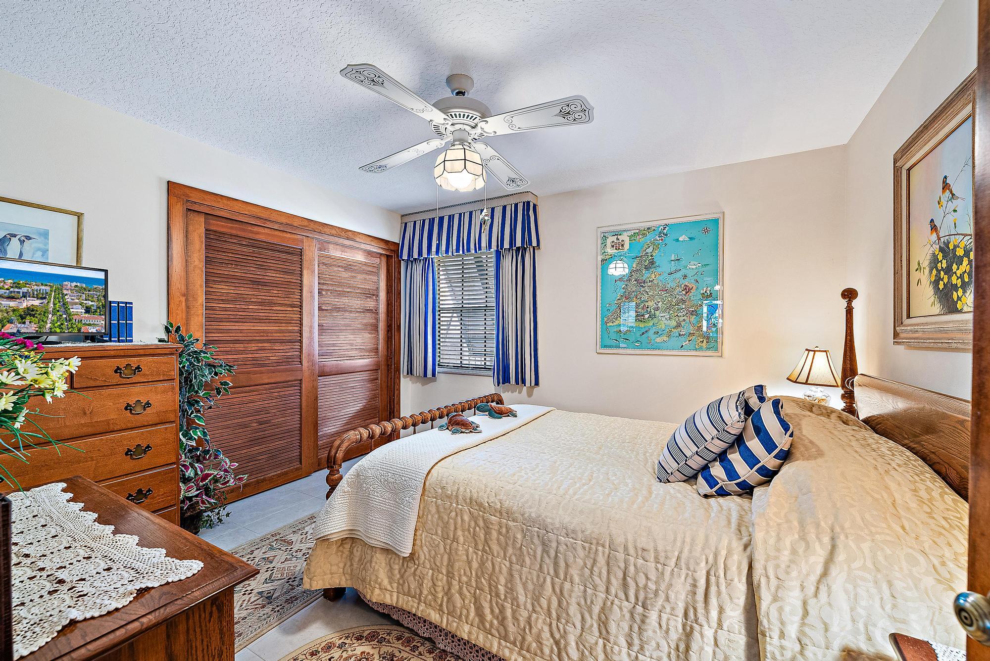 16800 128th Trail North Jupiter, FL 33478 - Photo 20 of 52 a bedroom with a bed and furniture