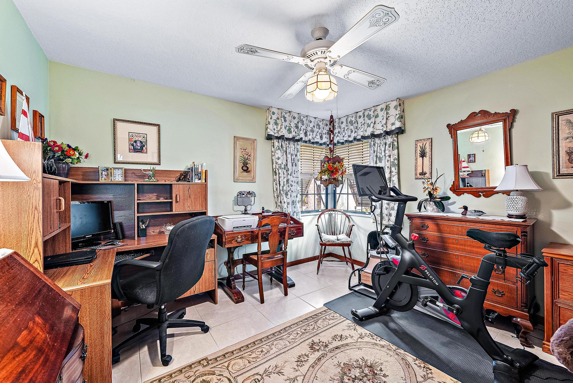 16800 128th Trail North Jupiter, FL 33478 - Photo 21 of 52 a view of a workspace with wooden floor and a workspace