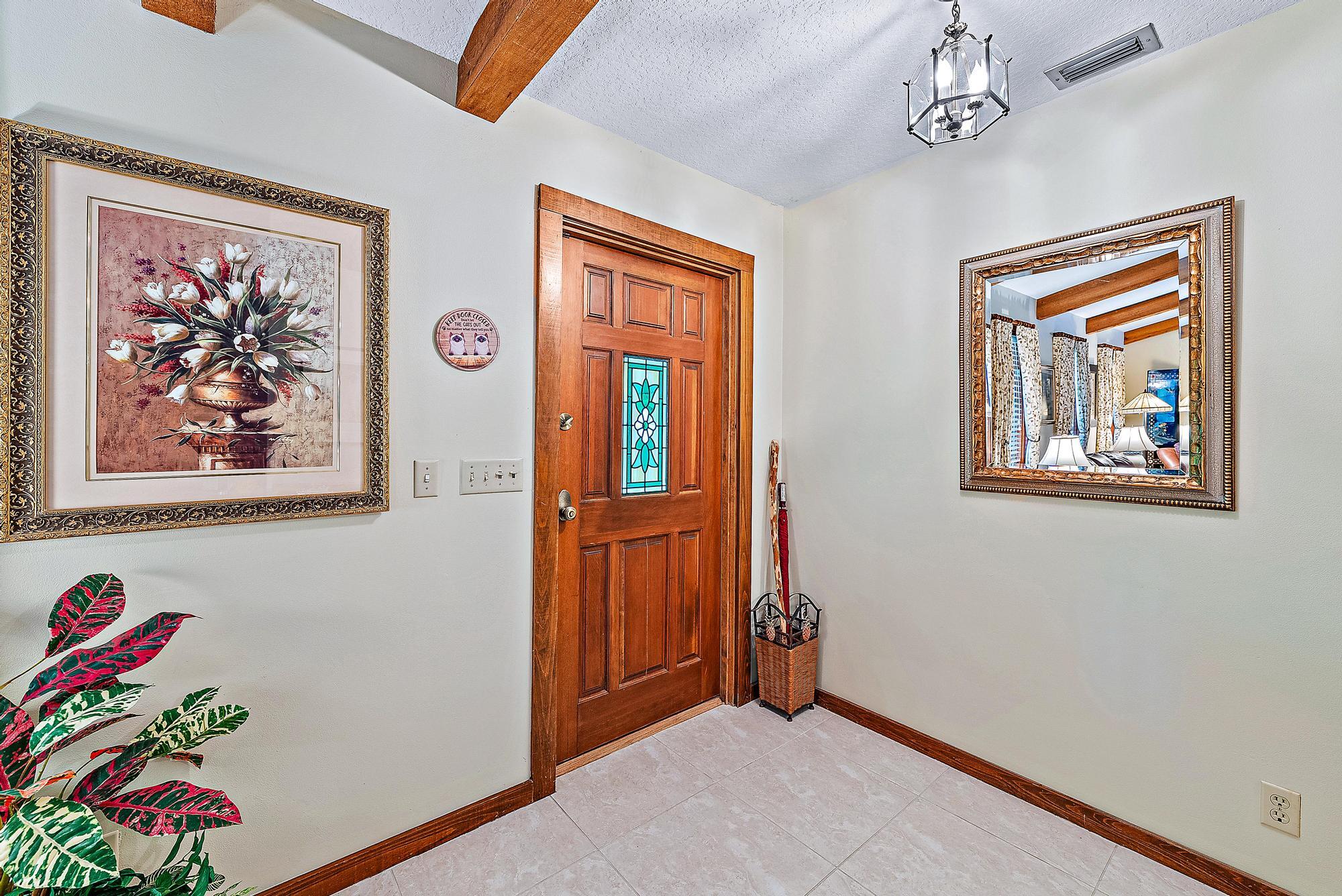 16800 128th Trail North Jupiter, FL 33478 - Photo 23 of 52 a view of an entryway with wooden floor