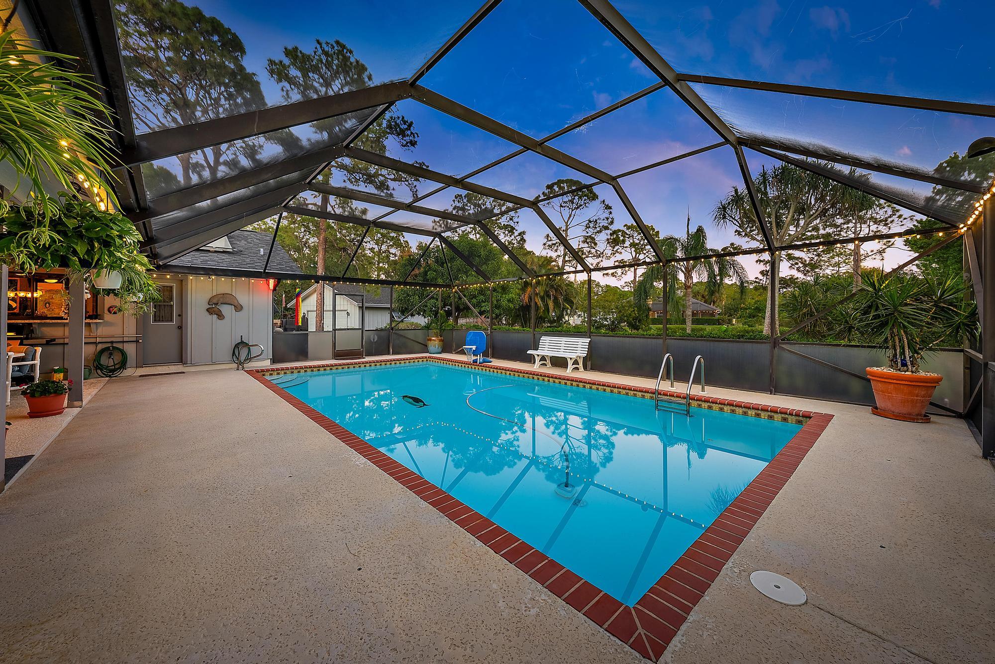 16800 128th Trail North Jupiter, FL 33478 - Photo 3 of 52 a view of a swimming pool with a patio