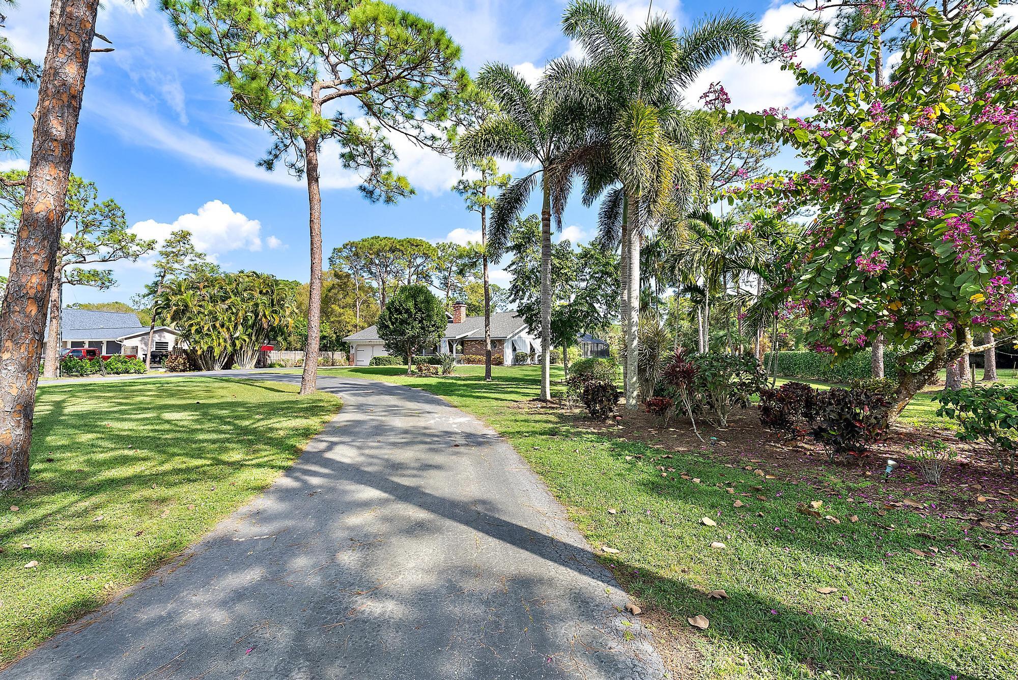 16800 128th Trail North Jupiter, FL 33478 - Photo 34 of 52 a view of a park with large trees