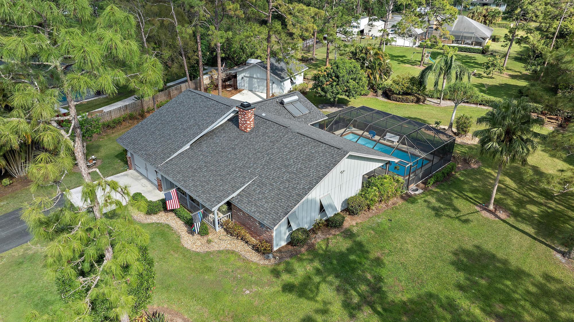 16800 128th Trail North Jupiter, FL 33478 - Photo 36 of 52 an aerial view of a house with a yard