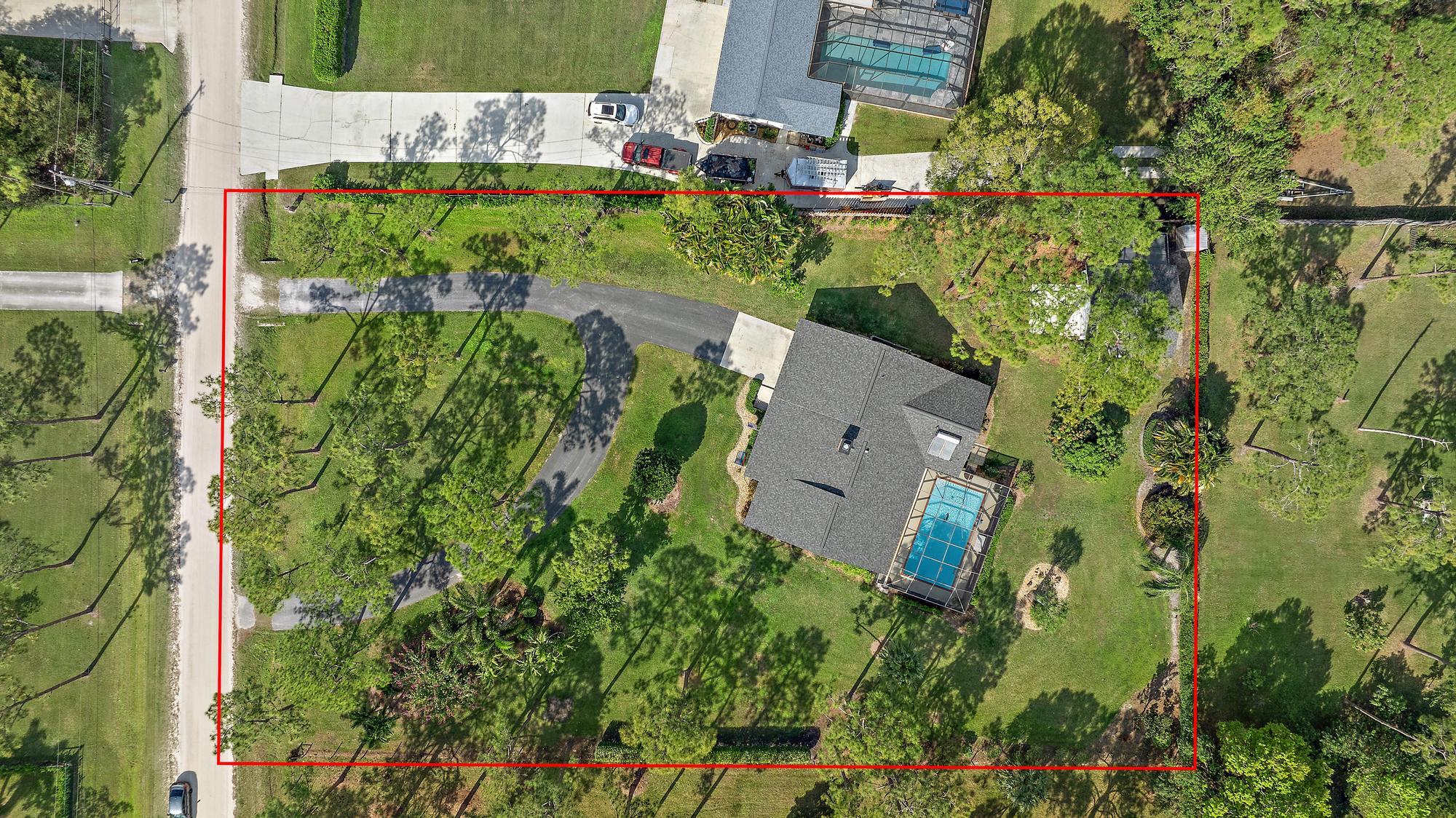 16800 128th Trail North Jupiter, FL 33478 - Photo 37 of 52 an aerial view of a house with a yard